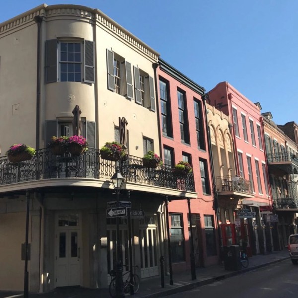 a street with cars parked on the side of a building