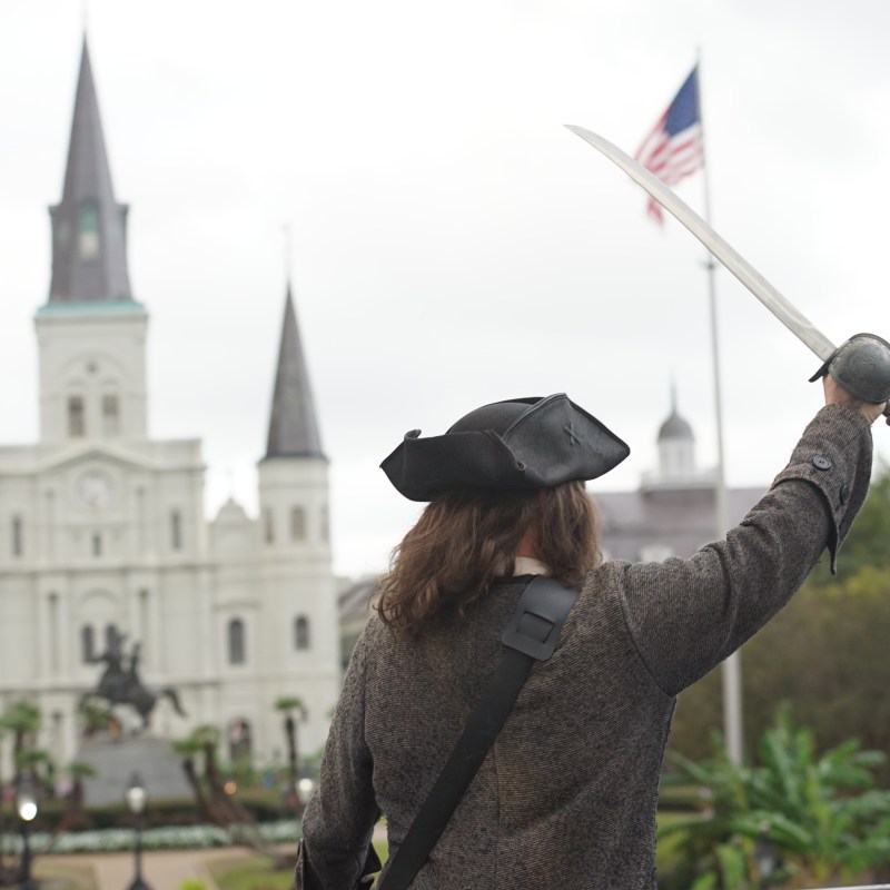 a person that is standing in the grass