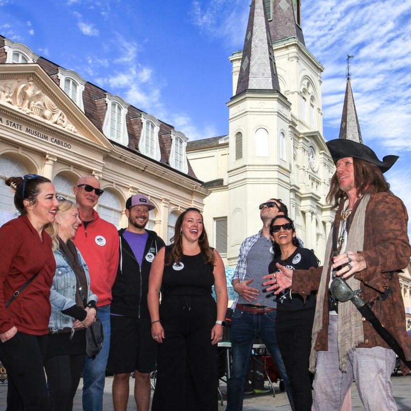 a group of people standing in front of a building