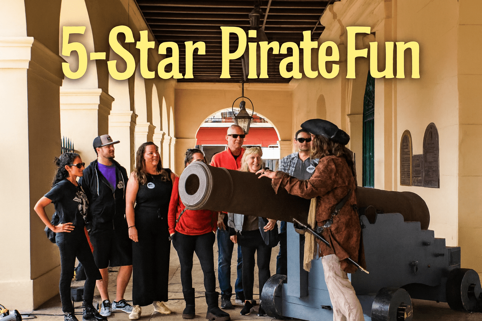 Group of people enjoying a pirate-themed activity near a cannon under an archway.